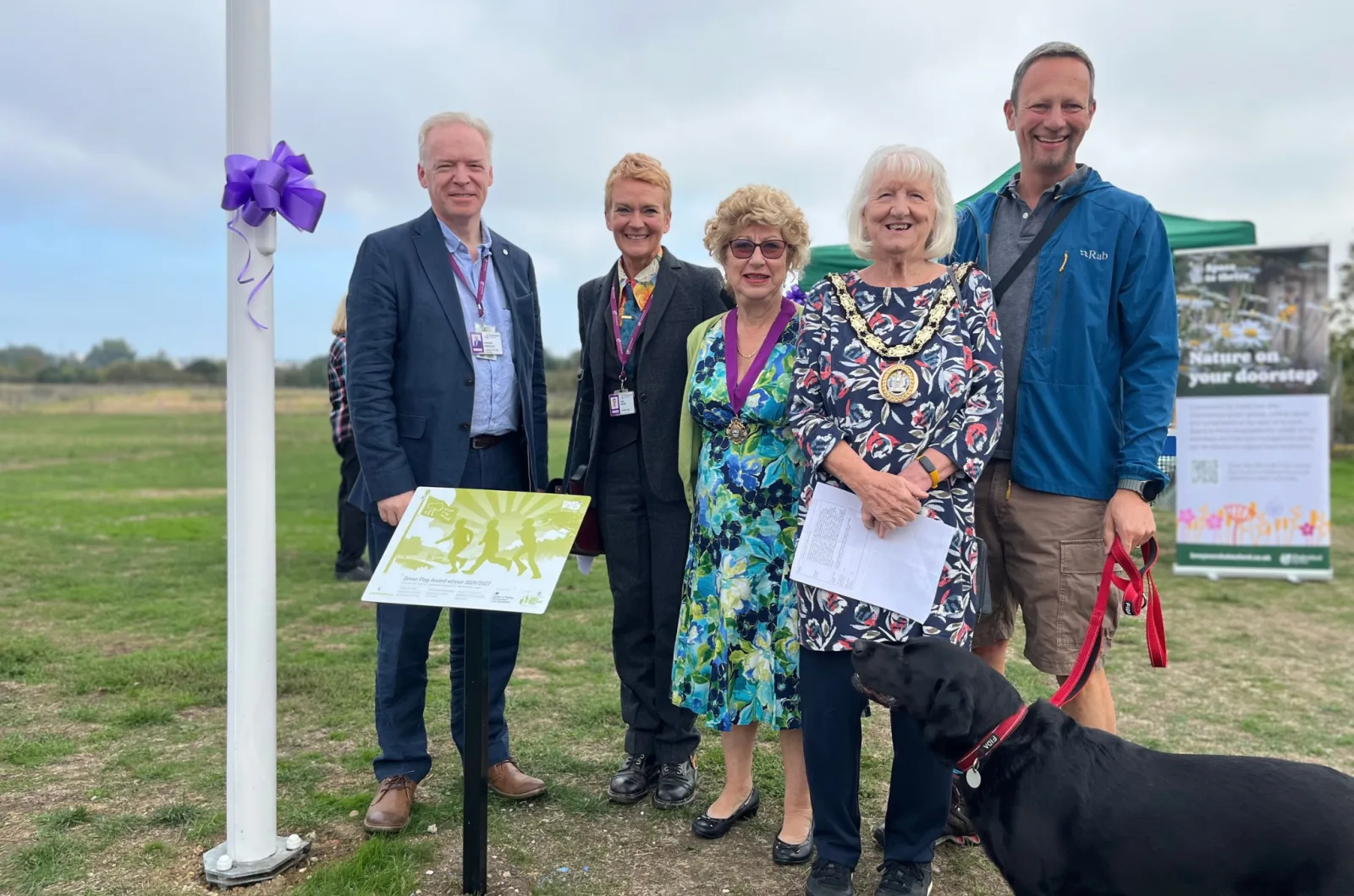 Guests at the Green Flag ceremony at John Shennan Field Local Nature Reserve on Friday 25 September, with the Mayor of Chelmsford wearing the chain of office and the new award plaque on the left.