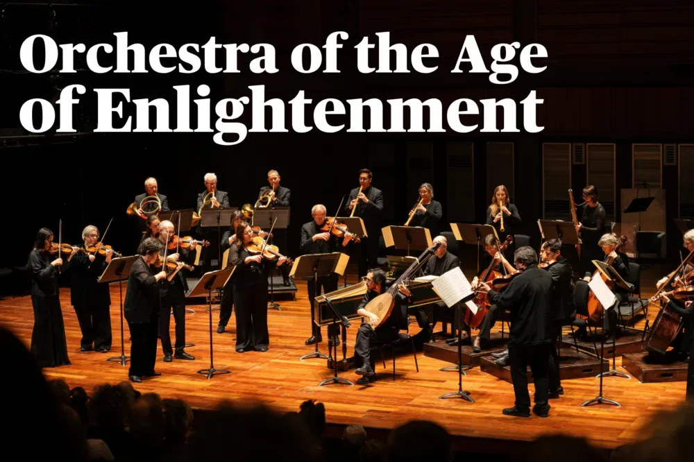 The Orchestra of the Age of Enlightenment performing on stage with period string, wind and brass instruments